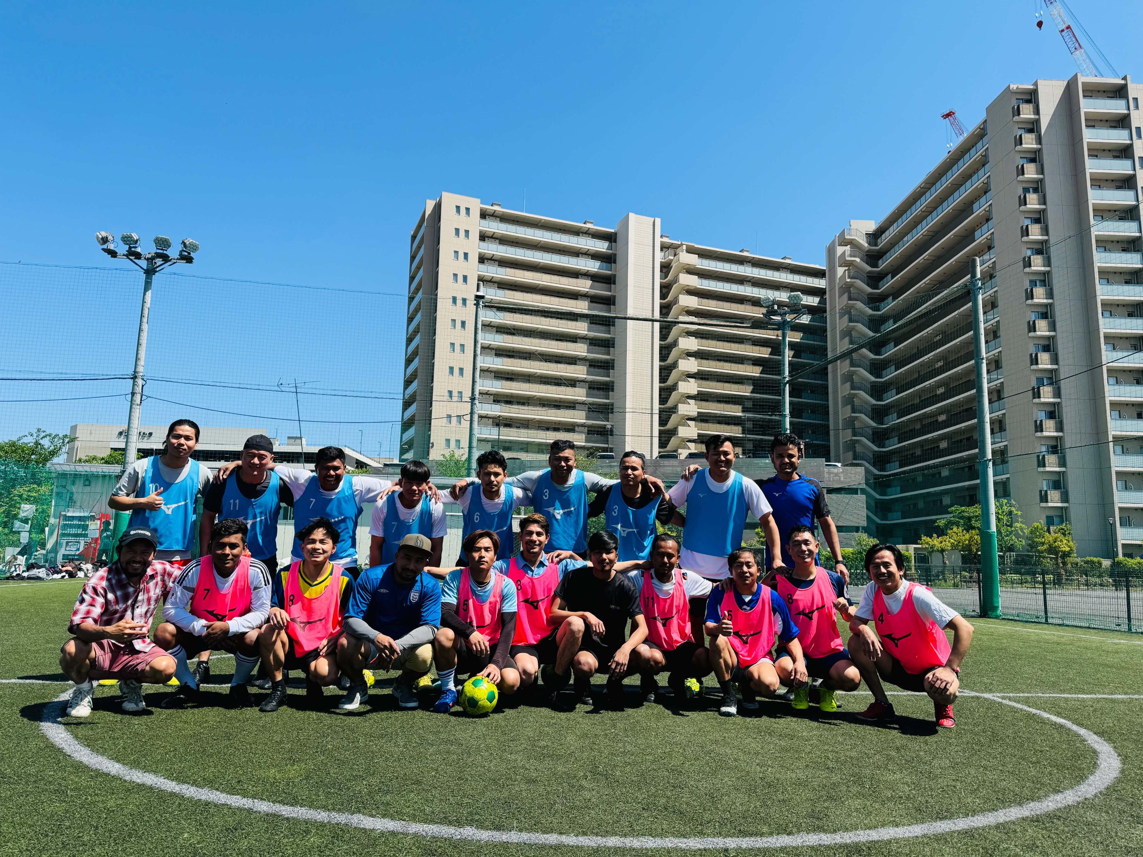 Purbeli FC players together on a football pitch in Tokyo